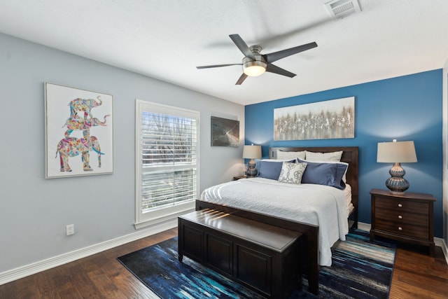 bedroom with dark wood-type flooring and ceiling fan