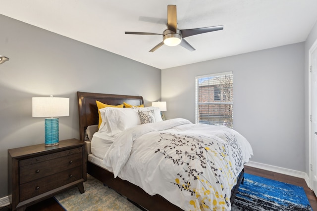 bedroom featuring dark hardwood / wood-style floors and ceiling fan