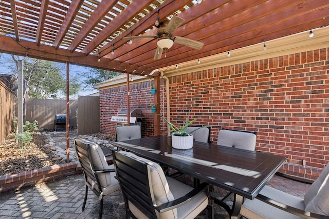 view of patio / terrace featuring grilling area, ceiling fan, and a pergola