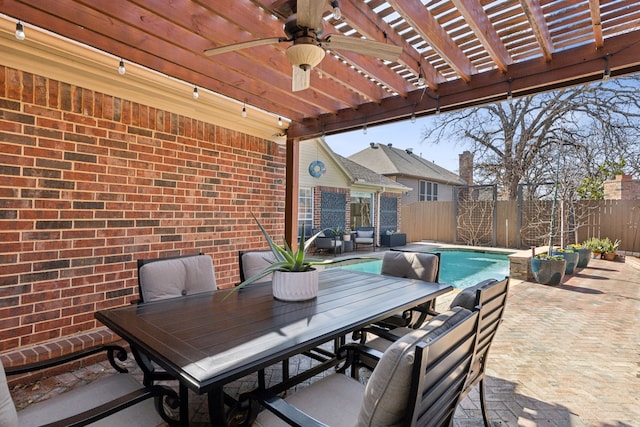 view of patio with ceiling fan, a pergola, and a fenced in pool