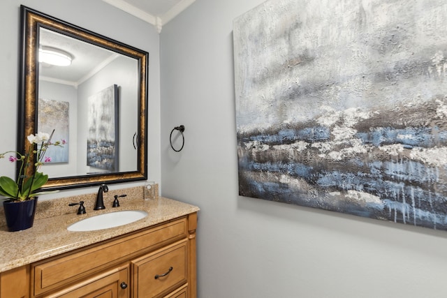 bathroom featuring crown molding and vanity