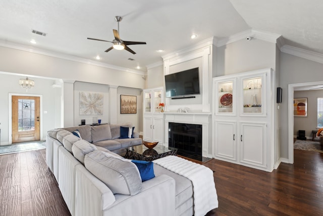 living room with lofted ceiling, crown molding, and dark wood-type flooring