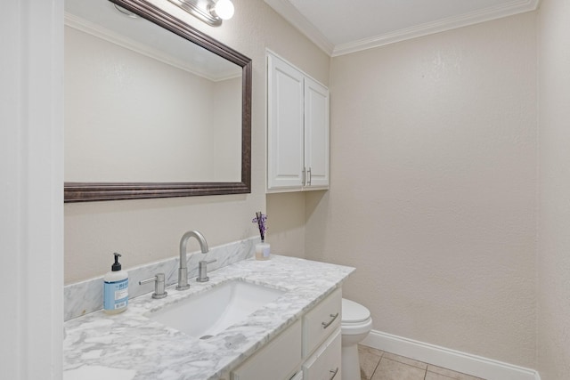 bathroom featuring vanity, tile patterned floors, crown molding, and toilet