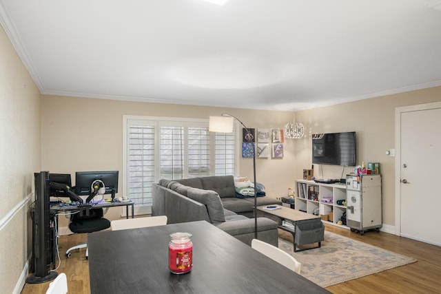 living room with ornamental molding and wood-type flooring