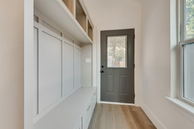 mudroom with light hardwood / wood-style flooring