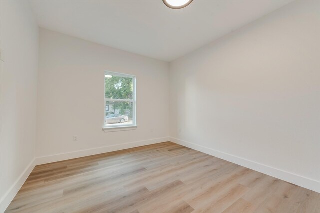 unfurnished room featuring light hardwood / wood-style floors