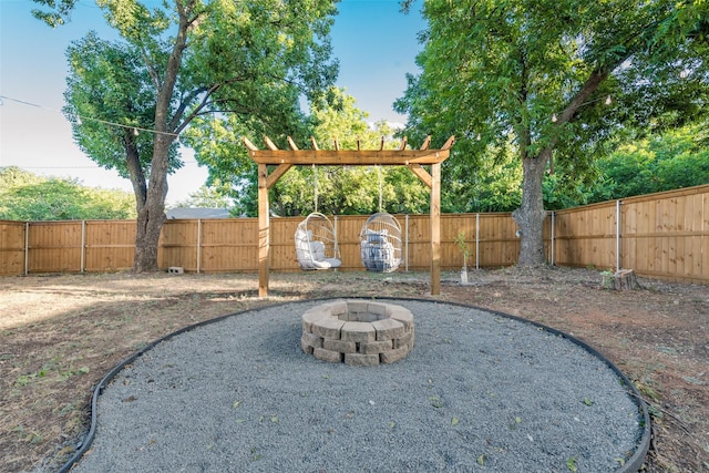 view of yard featuring a fire pit