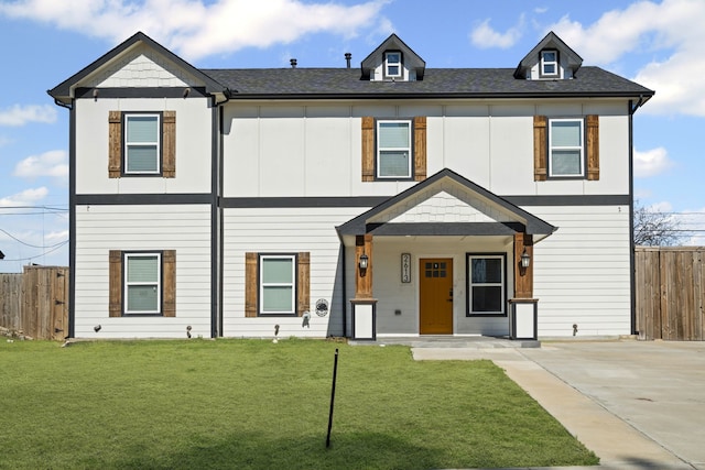 view of front of home with a porch and a front lawn