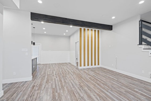 basement with light hardwood / wood-style floors