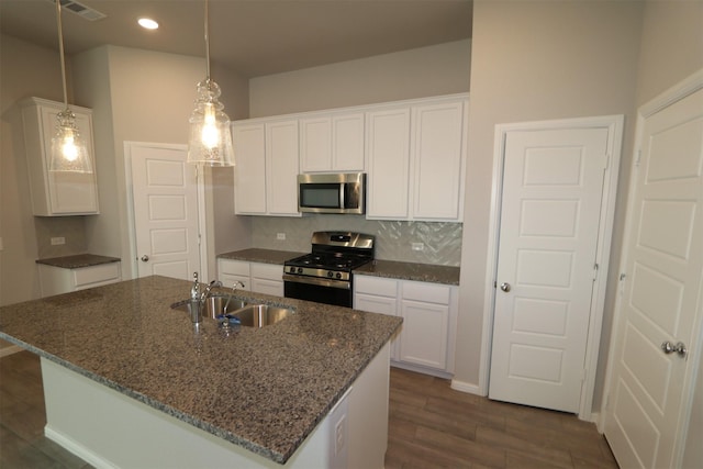 kitchen with sink, white cabinets, and appliances with stainless steel finishes