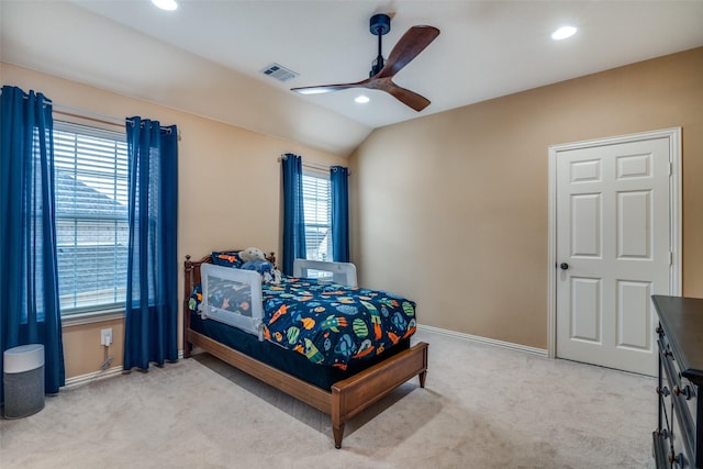 bedroom with lofted ceiling, light colored carpet, and ceiling fan