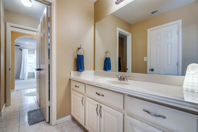 bathroom featuring tile patterned flooring and vanity