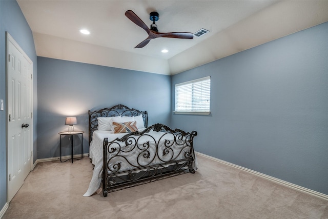 carpeted bedroom featuring vaulted ceiling and ceiling fan