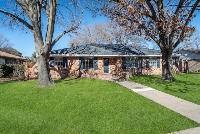 ranch-style home with a front yard