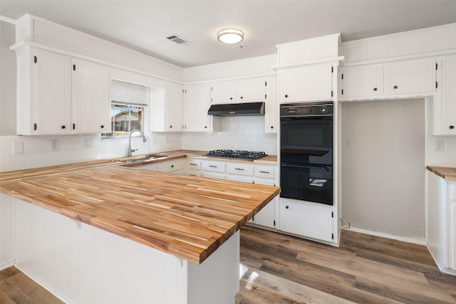 kitchen featuring black appliances, kitchen peninsula, sink, and white cabinets