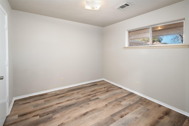 empty room featuring hardwood / wood-style flooring