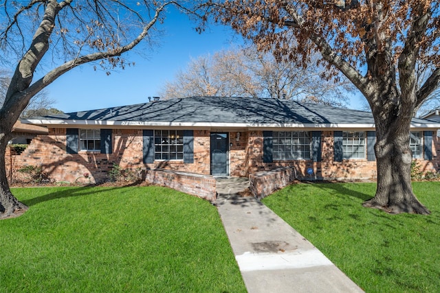 ranch-style home with a front lawn