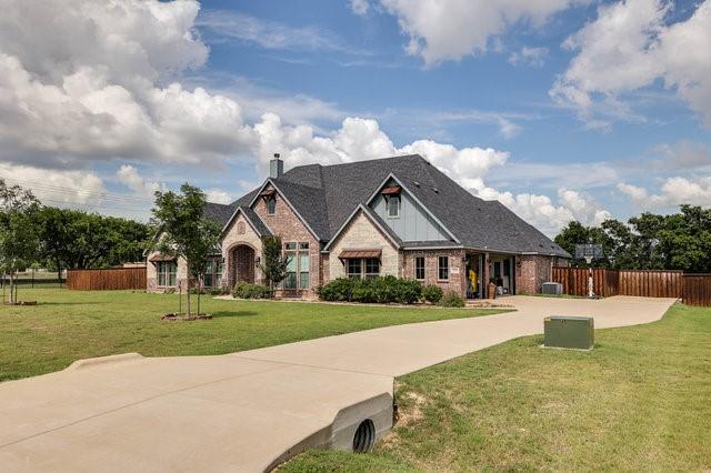 craftsman-style home with a front yard