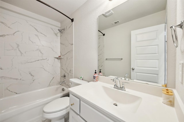 full bathroom featuring vanity, toilet, and tiled shower / bath