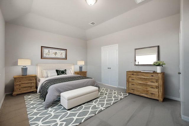 bedroom featuring carpet floors and vaulted ceiling