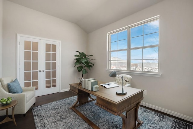 office with dark hardwood / wood-style floors, vaulted ceiling, and french doors