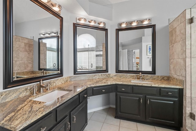 bathroom featuring double vanity, a sink, and tile patterned floors