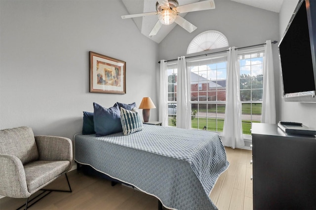 bedroom with vaulted ceiling, ceiling fan, and wood finished floors