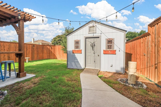 view of outbuilding featuring a fenced backyard and an outbuilding