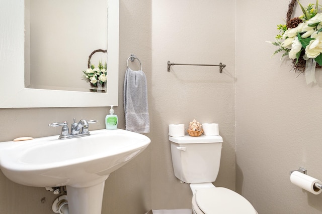 bathroom with sink and toilet