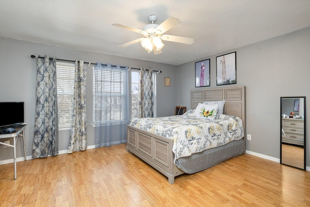 bedroom featuring light hardwood / wood-style flooring and ceiling fan