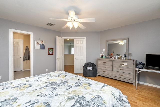 bedroom with wood-type flooring and ceiling fan