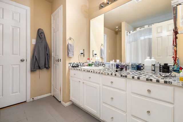 bathroom featuring vanity and tile patterned flooring