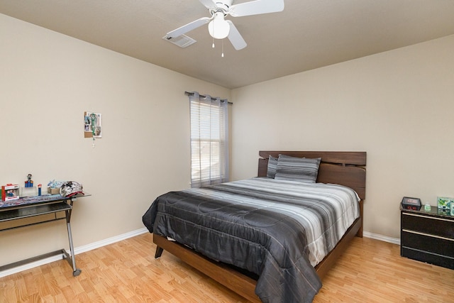 bedroom with ceiling fan and light wood-type flooring