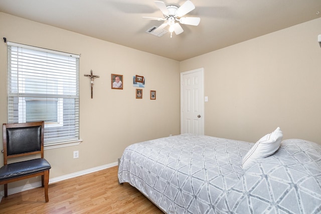 bedroom featuring hardwood / wood-style flooring and ceiling fan