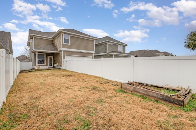 back of property featuring a yard