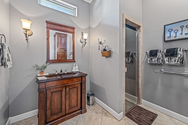 bathroom with vanity and a shower with shower door