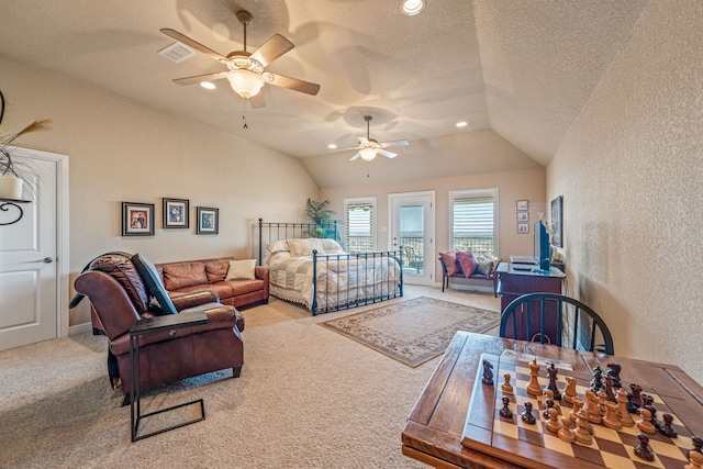 carpeted bedroom featuring lofted ceiling, ceiling fan, access to outside, and a textured ceiling