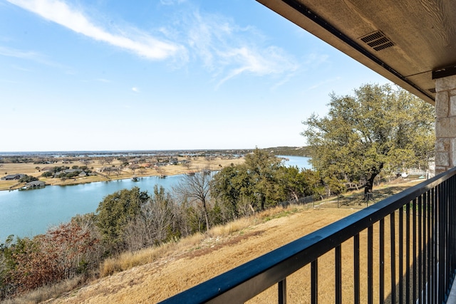 balcony featuring a water view