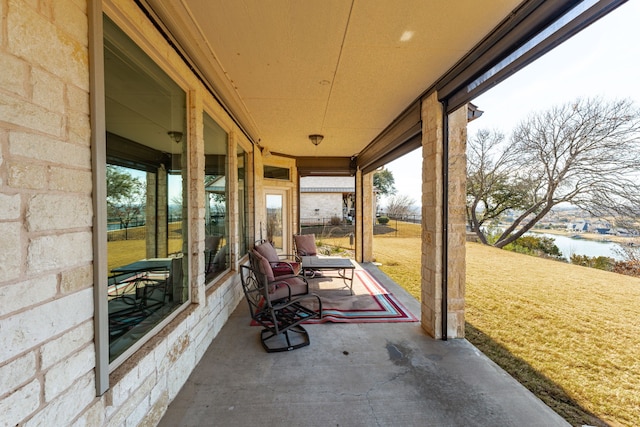 view of patio featuring a water view