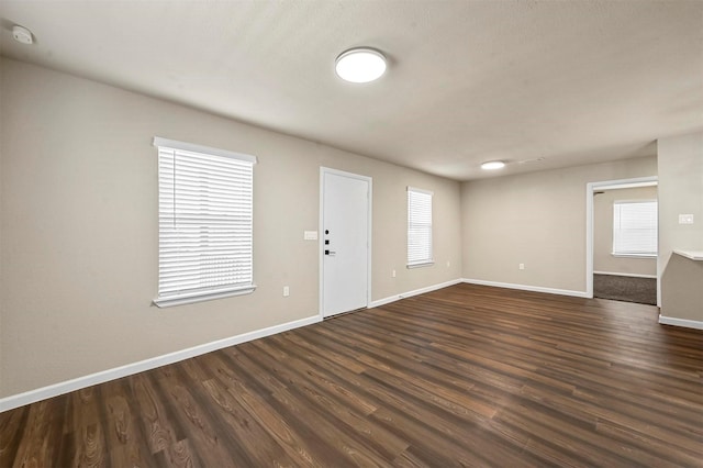 foyer entrance with dark hardwood / wood-style floors