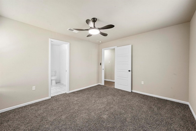 unfurnished bedroom with ensuite bath, ceiling fan, and carpet flooring