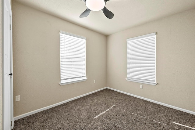 unfurnished room with carpet floors and ceiling fan