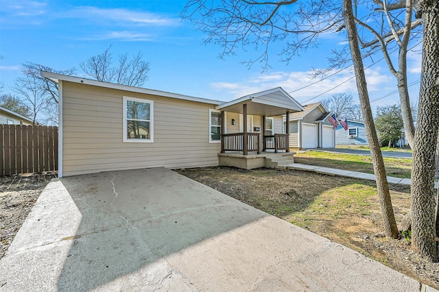 view of front of property with a garage and covered porch