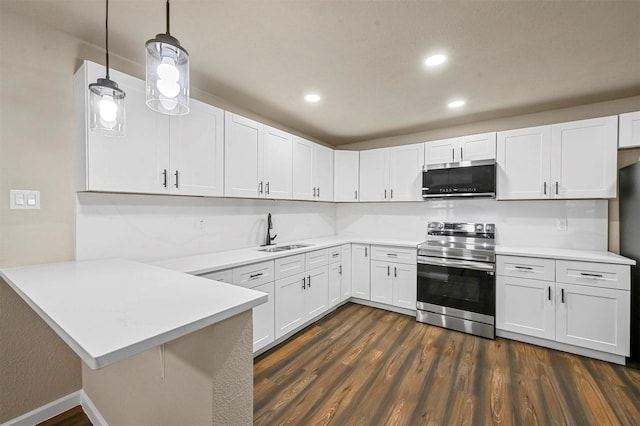 kitchen featuring sink, stainless steel range with electric cooktop, white cabinetry, kitchen peninsula, and pendant lighting