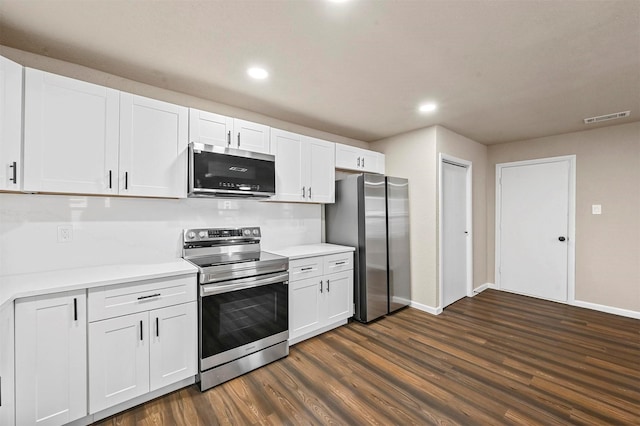 kitchen featuring white cabinetry, dark hardwood / wood-style flooring, and appliances with stainless steel finishes