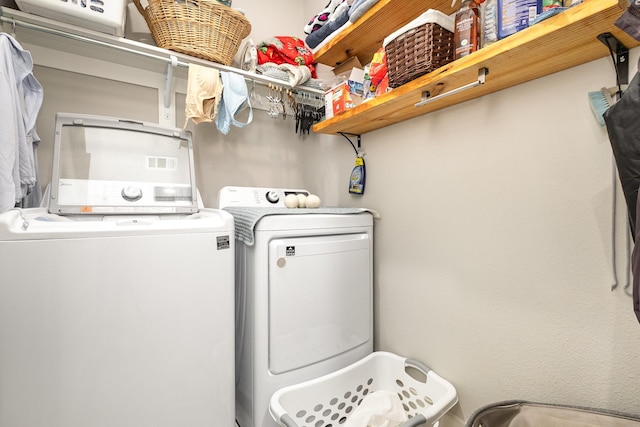 laundry room featuring independent washer and dryer