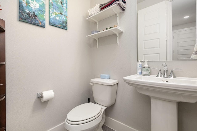 bathroom featuring sink and toilet