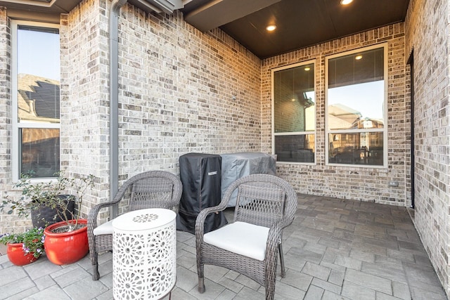 view of patio featuring a grill