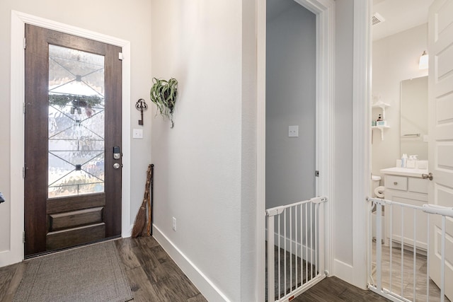 entrance foyer with dark hardwood / wood-style flooring