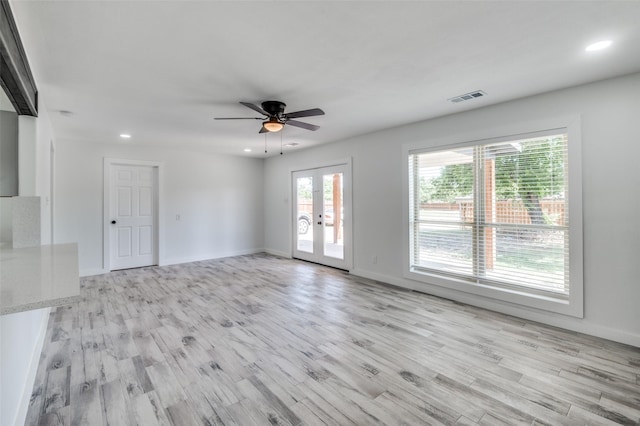 unfurnished room featuring french doors, light wood-style flooring, visible vents, and recessed lighting